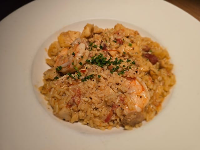 Paella (d).